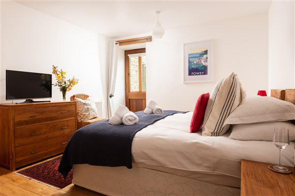 Bedroom with furniture and pictures on the wall